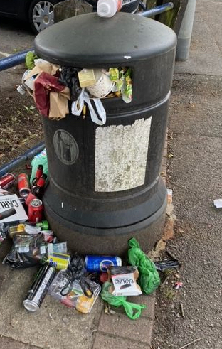 Overflowing litter bin